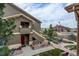 Condominium with a balcony overlooking the community clubhouse and outdoor swimming pool at 4730 Copeland Cir # 204, Highlands Ranch, CO 80126