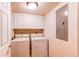 The laundry room offers a side-by-side washer and dryer for convenience at 4730 Copeland Cir # 204, Highlands Ranch, CO 80126