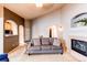 Bright living room featuring a gas fireplace, neutral walls and carpeted flooring at 4730 Copeland Cir # 204, Highlands Ranch, CO 80126