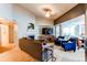 Comfortable living room with a fireplace and large windows providing natural light at 4730 Copeland Cir # 204, Highlands Ranch, CO 80126