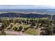 Vast landscape featuring multiple homes, rolling hills, and a picturesque view of a distant lake at 25392 Westridge Rd, Golden, CO 80403