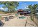 Beautiful backyard with tiered landscaping, garden beds, and wooded views at 25392 Westridge Rd, Golden, CO 80403
