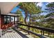 Exterior deck space with views of surrounding greenery and beautiful trees at 25392 Westridge Rd, Golden, CO 80403