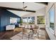 Stylish dining room featuring a modern chandelier, hardwood floors, and large windows with mountain views at 25392 Westridge Rd, Golden, CO 80403