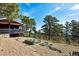A backyard oasis with raised garden beds and natural surroundings at 25392 Westridge Rd, Golden, CO 80403