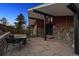 Inviting entryway featuring a flagstone patio and unique architectural details at 25392 Westridge Rd, Golden, CO 80403