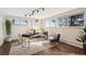 Bright home office with ample natural light, sleek desk, and stylish decor at 25392 Westridge Rd, Golden, CO 80403