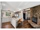 Modern kitchen with stainless steel appliances, granite countertops, and an open layout to the dining area at 25392 Westridge Rd, Golden, CO 80403