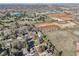 Aerial view of a residential area near open fields and a lake in the distance providing tranquility at 4152 S Vrain St, Denver, CO 80236
