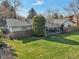 Aerial view showcases the property's large backyard and covered patio area at 4152 S Vrain St, Denver, CO 80236