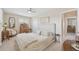 Bedroom with ceiling fan, a neutral color scheme, and a decorative headboard at 4152 S Vrain St, Denver, CO 80236