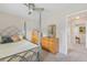 Bedroom with ceiling fan, neutral tones, and a decorative bedframe at 4152 S Vrain St, Denver, CO 80236