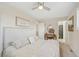 Bedroom with neutral colors, ceiling fan, and ensuite bathroom at 4152 S Vrain St, Denver, CO 80236