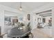 Open dining room with classic furniture open to the living and sitting rooms at 4152 S Vrain St, Denver, CO 80236
