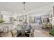 Open concept dining area leading to the kitchen and a cozy living space at 4152 S Vrain St, Denver, CO 80236