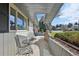 Inviting front porch area featuring a seating area overlooking the landscaped front yard and neighborhood at 4152 S Vrain St, Denver, CO 80236