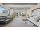 Spacious living room with open layout, modern furniture, and a view of the dining area at 4152 S Vrain St, Denver, CO 80236