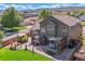 Spacious backyard features a deck, patio, dining area, and mature landscaping creating a private outdoor retreat at 6590 S Tabor St, Littleton, CO 80127
