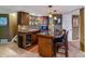 Inviting bar area with stylish counters, seating, and a wine fridge at 6590 S Tabor St, Littleton, CO 80127