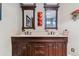 Bathroom featuring a double sink vanity with marble countertops and dark wood cabinets at 6590 S Tabor St, Littleton, CO 80127