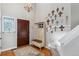 Inviting foyer with hardwood floors, coat rack, and decorative accents at 6590 S Tabor St, Littleton, CO 80127