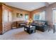Cozy living room with a comfortable sofa, a piano, and stylish furniture at 6590 S Tabor St, Littleton, CO 80127