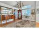 Bright living room featuring large windows, hardwood floors, and elegant furniture at 6590 S Tabor St, Littleton, CO 80127