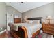 Inviting main bedroom with a leather-trimmed bed and natural light at 6590 S Tabor St, Littleton, CO 80127