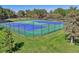 Well-maintained tennis courts surrounded by lush greenery, providing a great amenity for sports and recreation at 6590 S Tabor St, Littleton, CO 80127