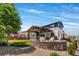 Large backyard featuring a patio with a covered dining area, a fire pit with seating, and a well-maintained lawn at 14110 Pastel Ln, Parker, CO 80134