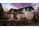 Gorgeous covered outdoor living space with a patio, fire pit, and fenced yard at 14110 Pastel Ln, Parker, CO 80134