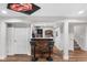Finished basement with a stylish bar featuring rustic wood accents, a white countertop, and a comfortable seating area at 14110 Pastel Ln, Parker, CO 80134