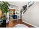 Welcoming entry foyer featuring hardwood floors, a staircase, and an adjacent office at 14110 Pastel Ln, Parker, CO 80134