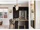Elegant kitchen island with barstool seating, stainless steel appliances, and stylish pendant lighting at 14110 Pastel Ln, Parker, CO 80134