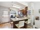 Stylish kitchen featuring granite countertops, stainless steel appliances, and a breakfast bar at 1811 S Quebec Way # 221, Denver, CO 80231