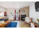Comfortable living room with a fireplace, hardwood floors, and an inviting atmosphere at 1811 S Quebec Way # 221, Denver, CO 80231