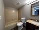 Full bathroom features tile flooring, shower and tub combo, vanity, and neutral finishes at 2575 S Syracuse Way # M108, Denver, CO 80231