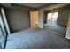 Bright and sunny bedroom includes carpet, closet and door to patio at 2575 S Syracuse Way # M108, Denver, CO 80231