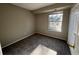 This bedroom includes a large window providing natural light and a closet at 2575 S Syracuse Way # M108, Denver, CO 80231