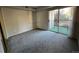 Bedroom with sliding glass doors to patio at 2575 S Syracuse Way # M108, Denver, CO 80231
