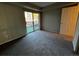 Bright bedroom features a sliding door to a private outdoor patio at 2575 S Syracuse Way # M108, Denver, CO 80231