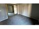 This bedroom includes gray walls, carpet and a closet with mirrored sliding doors at 2575 S Syracuse Way # M108, Denver, CO 80231