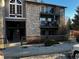 Exterior view of building shows stairs and balcony view of the surrounding landscape at 2575 S Syracuse Way # M108, Denver, CO 80231