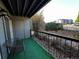 Cozy outdoor patio with green turf, seating, and views of the surrounding foliage at 2575 S Syracuse Way # M108, Denver, CO 80231