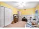Cozy bedroom featuring charming decor and a white ceiling fan for added comfort at 5491 S Youngfield W Ct, Littleton, CO 80127