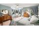 Bright bedroom featuring a bay window with window seat and plenty of natural light at 5491 S Youngfield W Ct, Littleton, CO 80127