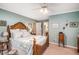 Comfortable bedroom featuring a ceiling fan and classic wooden furniture at 5491 S Youngfield W Ct, Littleton, CO 80127