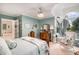 Inviting bedroom featuring a window seat, ceiling fan, and classic decor at 5491 S Youngfield W Ct, Littleton, CO 80127