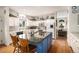 Bright kitchen with an island, offering an open layout to the living area at 5491 S Youngfield W Ct, Littleton, CO 80127