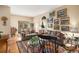 Bright living room seamlessly connects to the dining area, offering an open and airy atmosphere, perfect for entertaining at 5491 S Youngfield W Ct, Littleton, CO 80127